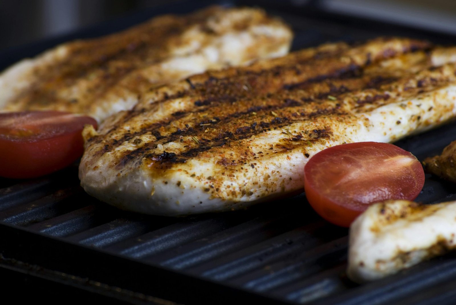 Close-up of grilled chicken breasts with tomatoes sizzling on a barbecue grill, perfect for a delicious meal, meat, barbecue, grill, bbq, barbeque, cooking, grilling, food, steak, tasty, delicious, closeup, meat, meat, meat, grill, bbq, cooking, cooking, food, food, food, food, food, steak, grill, barbecue, sekuwa, sekuwa by kilo, MRP beer Restaurant, restaurant near me, lakeside, pokhara, chipledhunga, restaurant in pokhara, restaurant in lakeside, grilled chicken/pork slices, grill chicken, oven grilled chicken, firewood barbecue, firewood pizza, Grill n Chill, Grill n Chill pokhara, Grill n Chill in Chipledhunga, Pokhara, serves barbecue & grill by kg, live grilled chicken & pork, lakeside outdoor seating, organic coffee & family‑friendly vibes, Live Grill Restaurant in Pokhara, Grilled chicken slices at Grill n Chill Pokhara outdoor grill, Barbecue by Kg, sekuwa by kilo, MRP beer restaurant, 5 Reasons to Try Backyard‑style Barbecue at Grill n Chill, Grill n Chill Menu, restaurant menu,